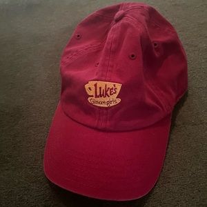 Maroon hat. “Luke’s Gilmore Girls” logo